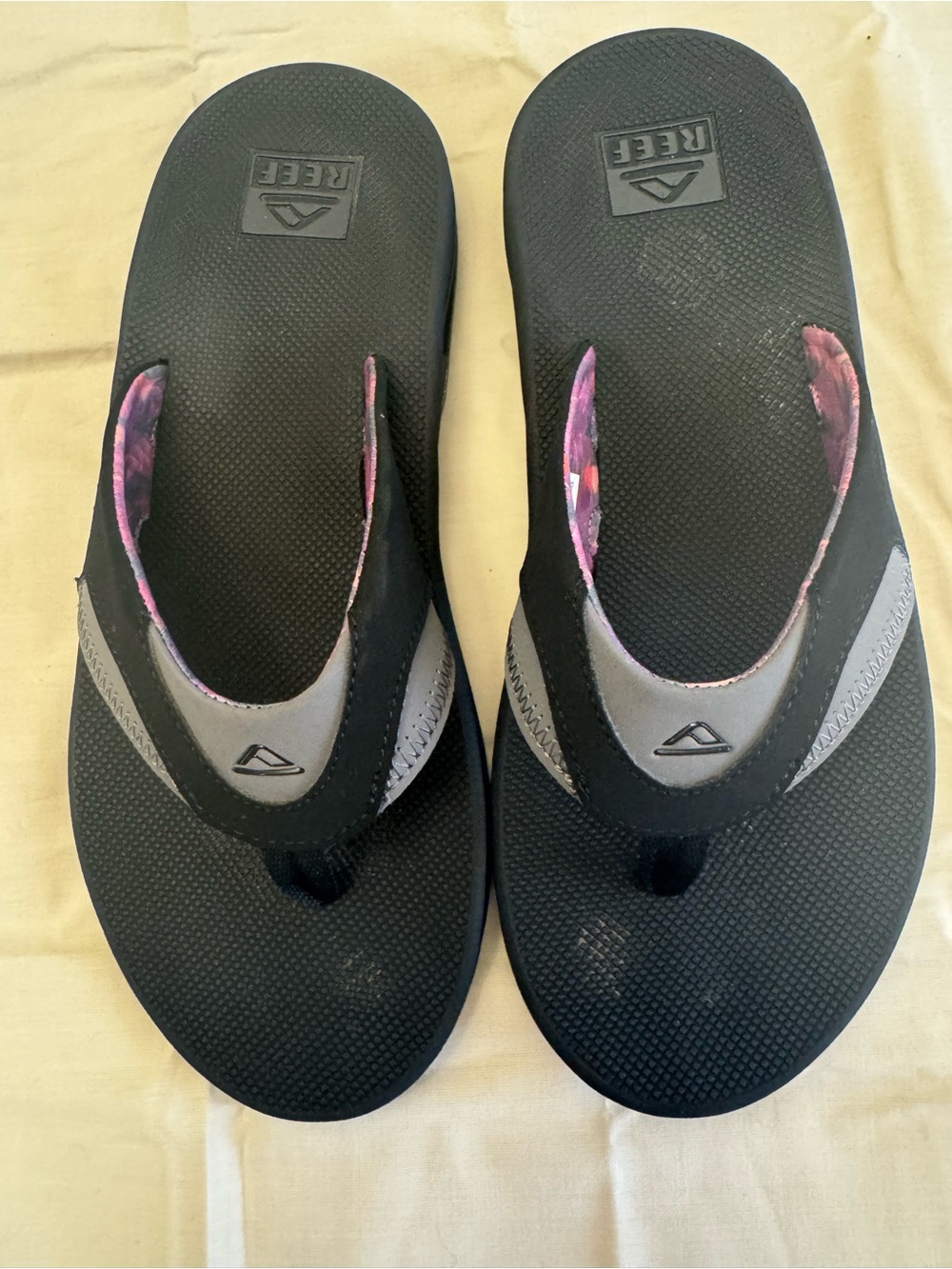 Reef Flip Flops with Purple and Pink Patterned Straps